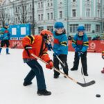 Children playing ice hockey