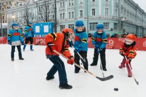 Children playing ice hockey